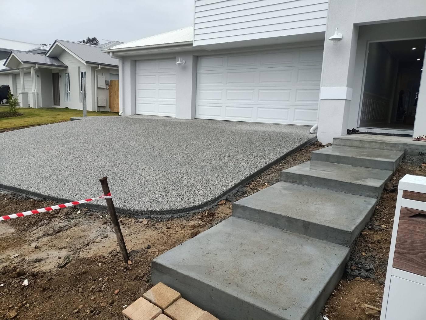Exposed aggregate driveway with floating concrete steps